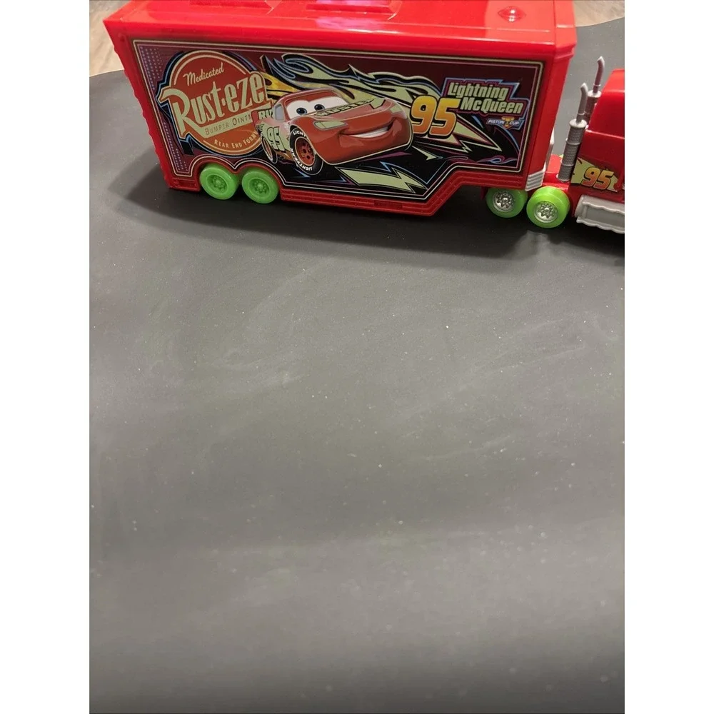 Disney Pixar Cars Lot - Mack Transforming Playset Hauler & Moving Moments Mater
